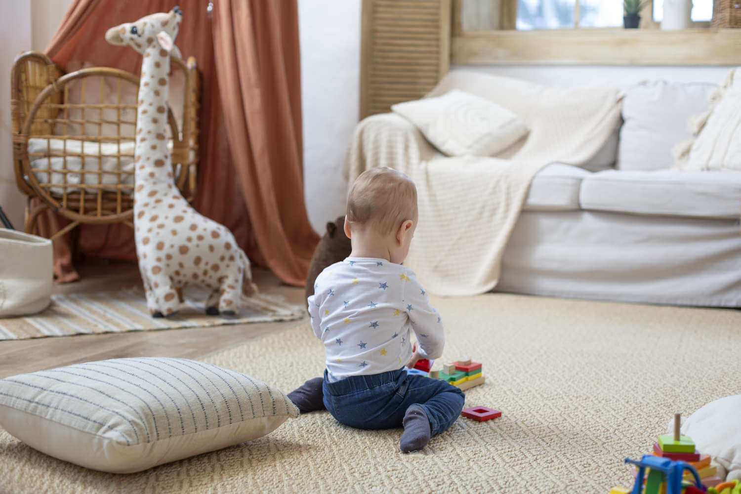 full-shot-cute-baby-playing-home.jpg