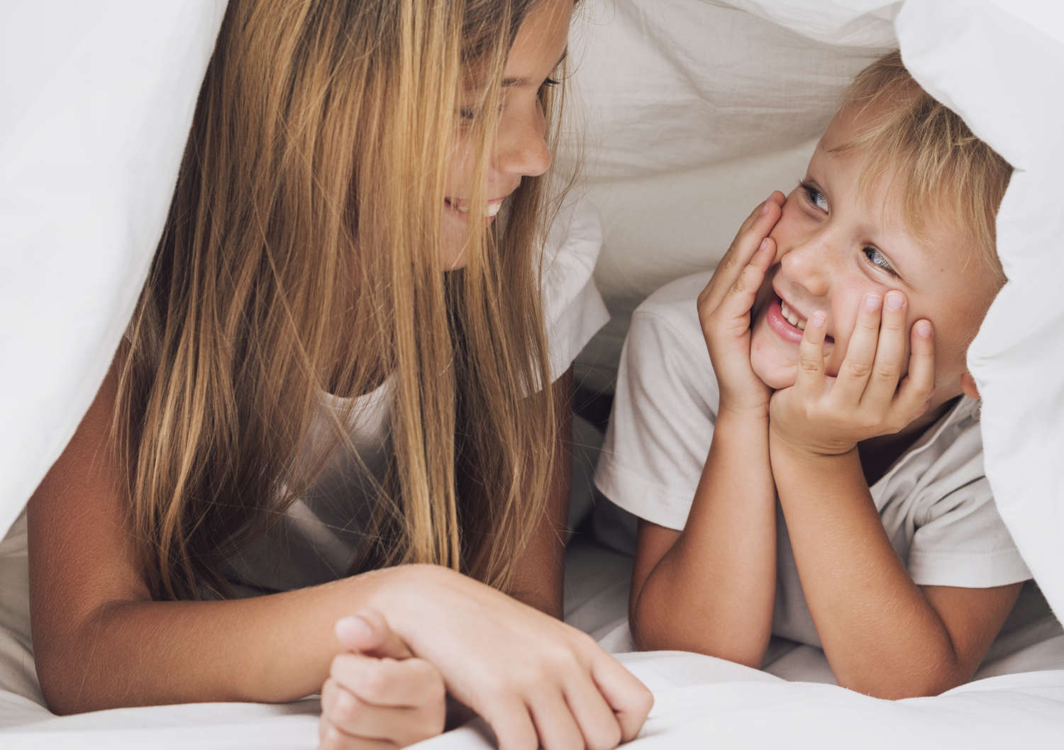 smiley-siblings-looking-each-other-close-up.jpg